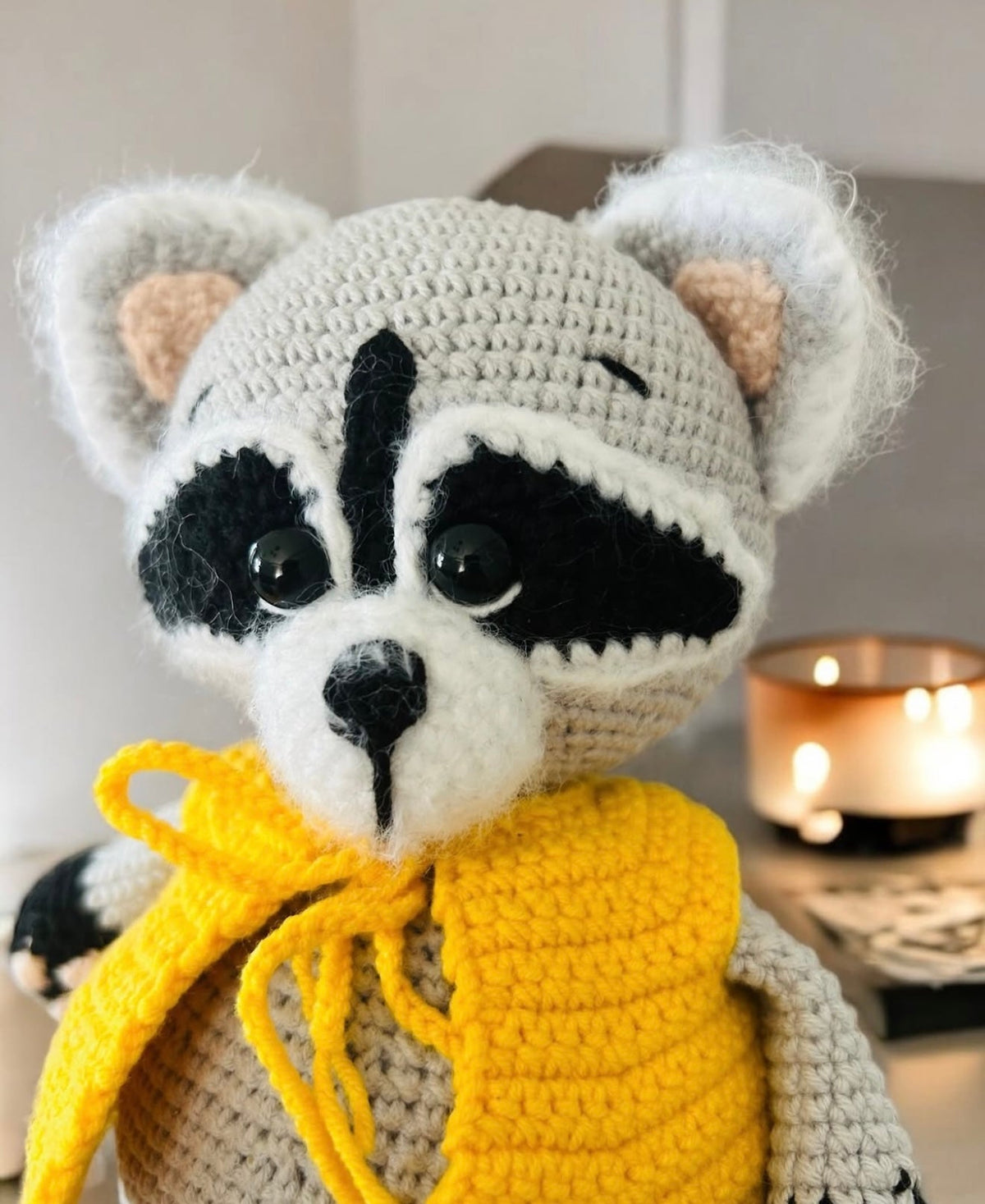 Crochet Cute Raccoon toy with a yellow vest