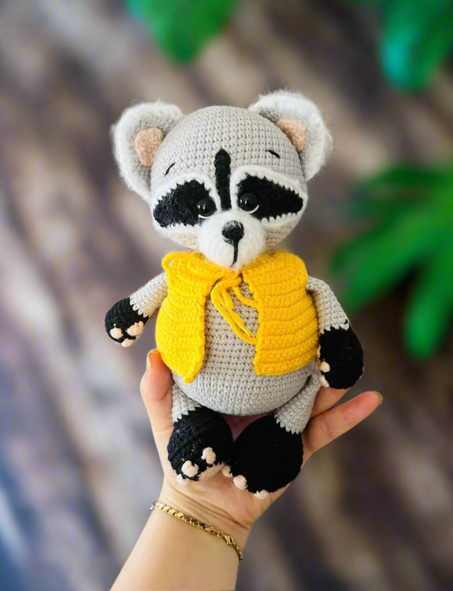 Crochet Cute Raccoon toy with a yellow vest